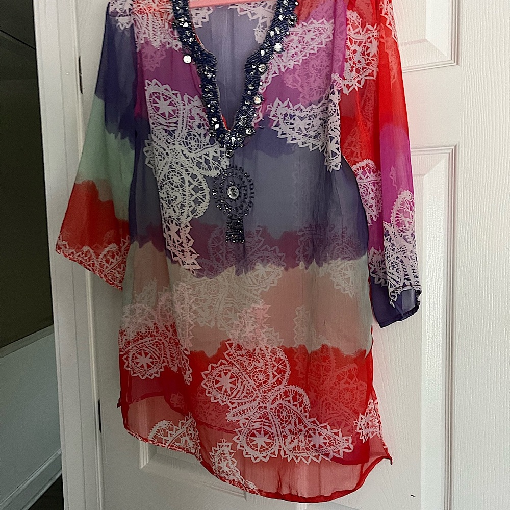 Beach cover up. Wear with jeans as well (white or denim)